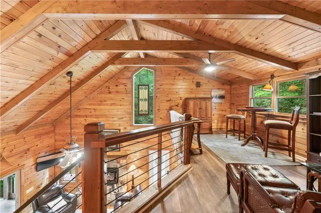 a view of a chair and table in backyard of the house