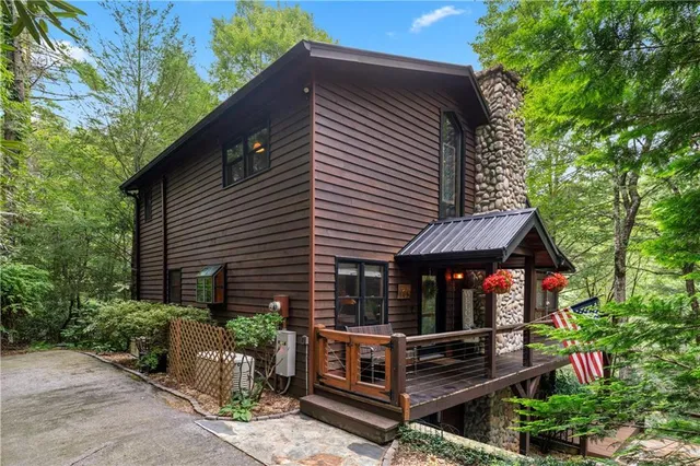 a view of house with backyard and garden