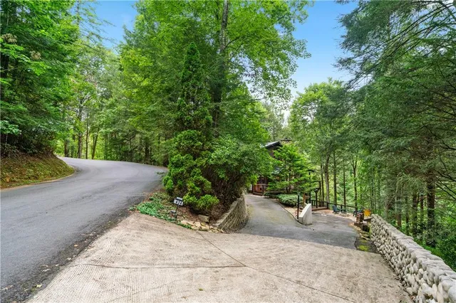a kitchen with granite countertop a sink stove and cabinets