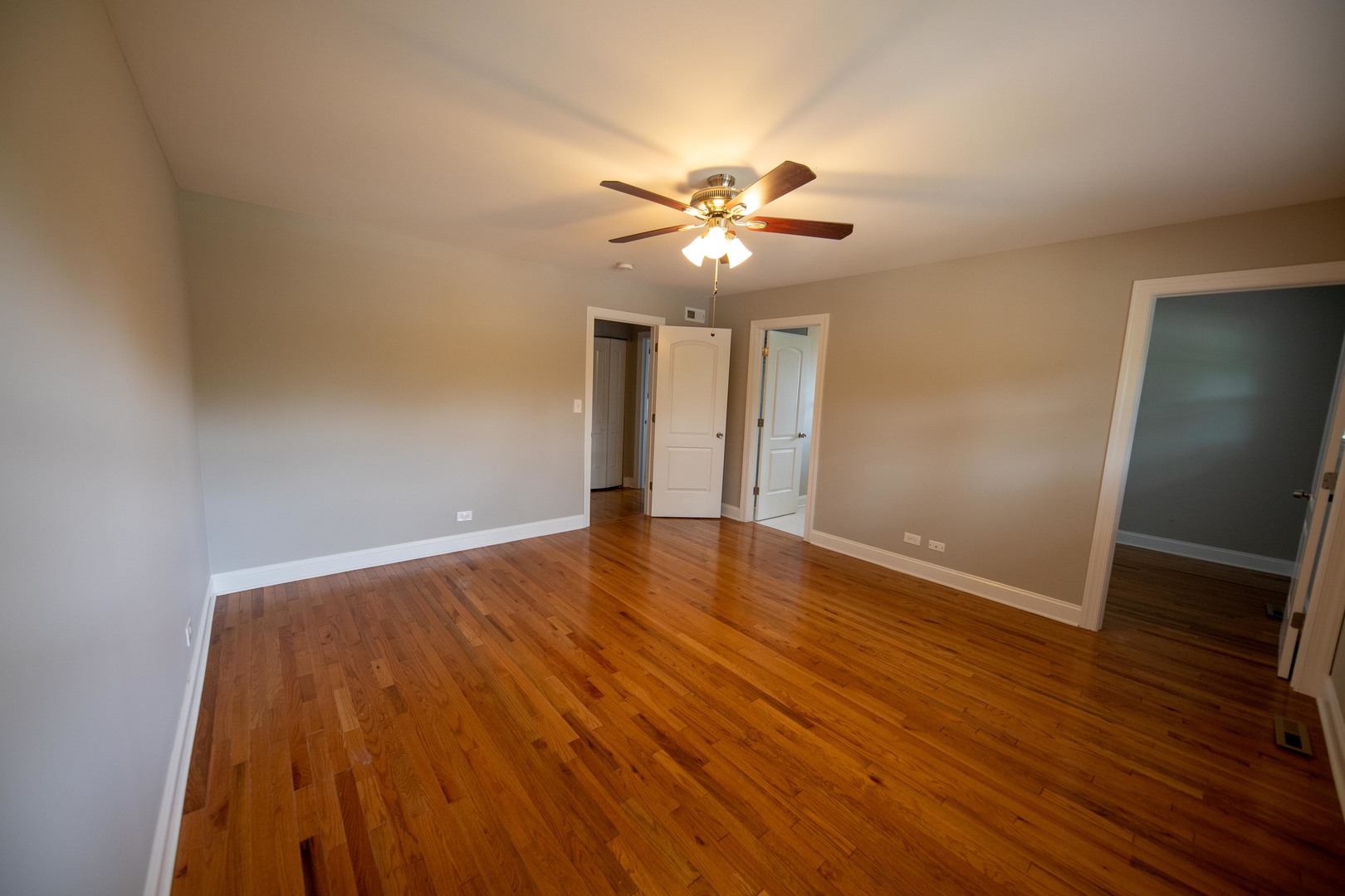 1722 East Aztec Lane Mount Prospect, IL 60056 - Photo 11 of 18 a view of an empty room with wooden floor