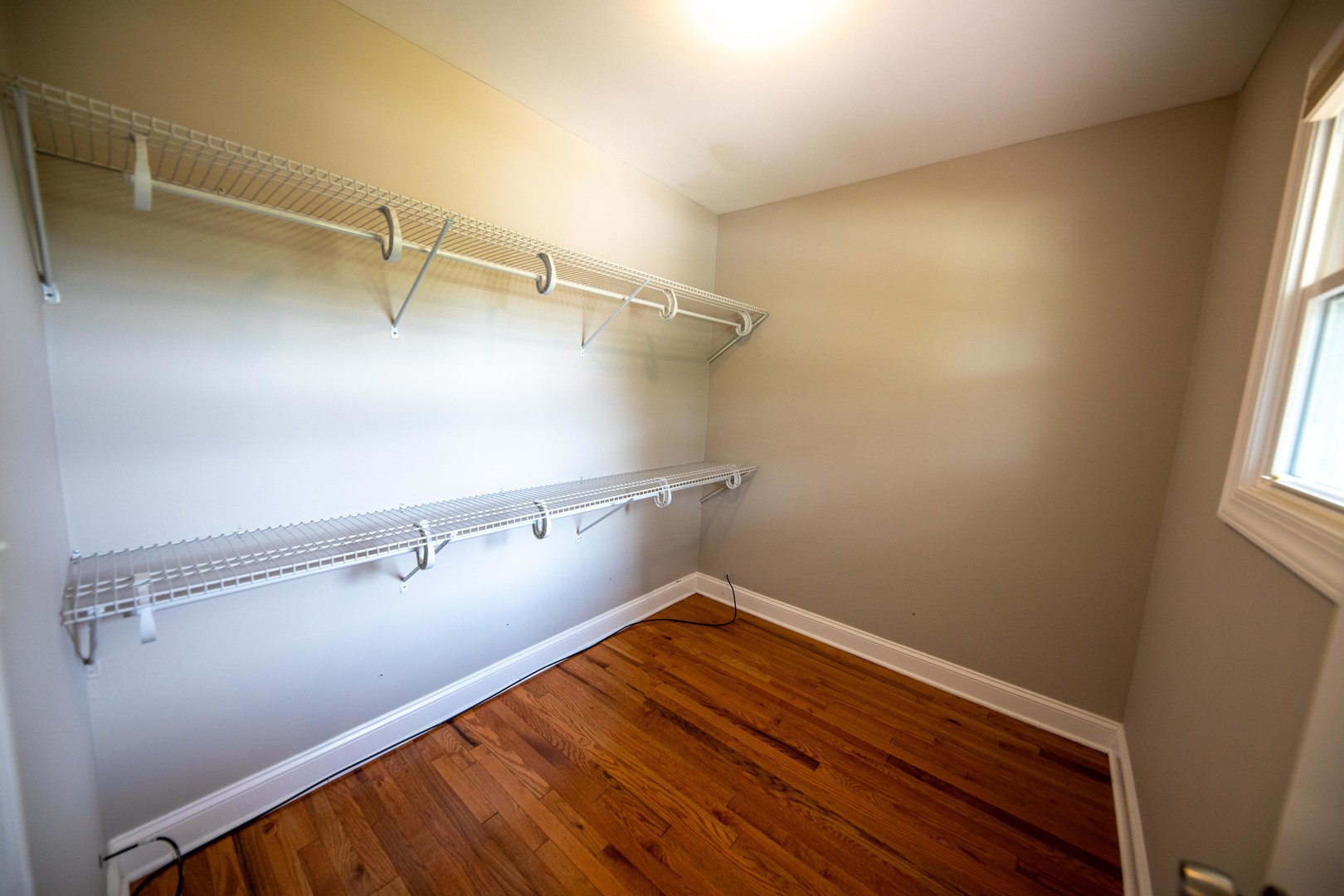 1722 East Aztec Lane Mount Prospect, IL 60056 - Photo 14 of 18 a view of a room with racks on the wall