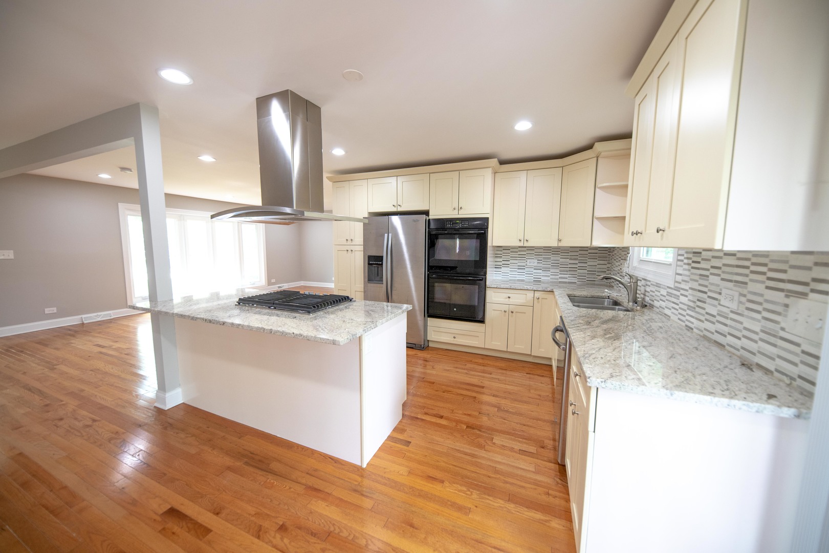 1722 East Aztec Lane Mount Prospect, IL 60056 - Photo 5 of 18 a kitchen with stainless steel appliances granite countertop a sink a stove and a refrigerator