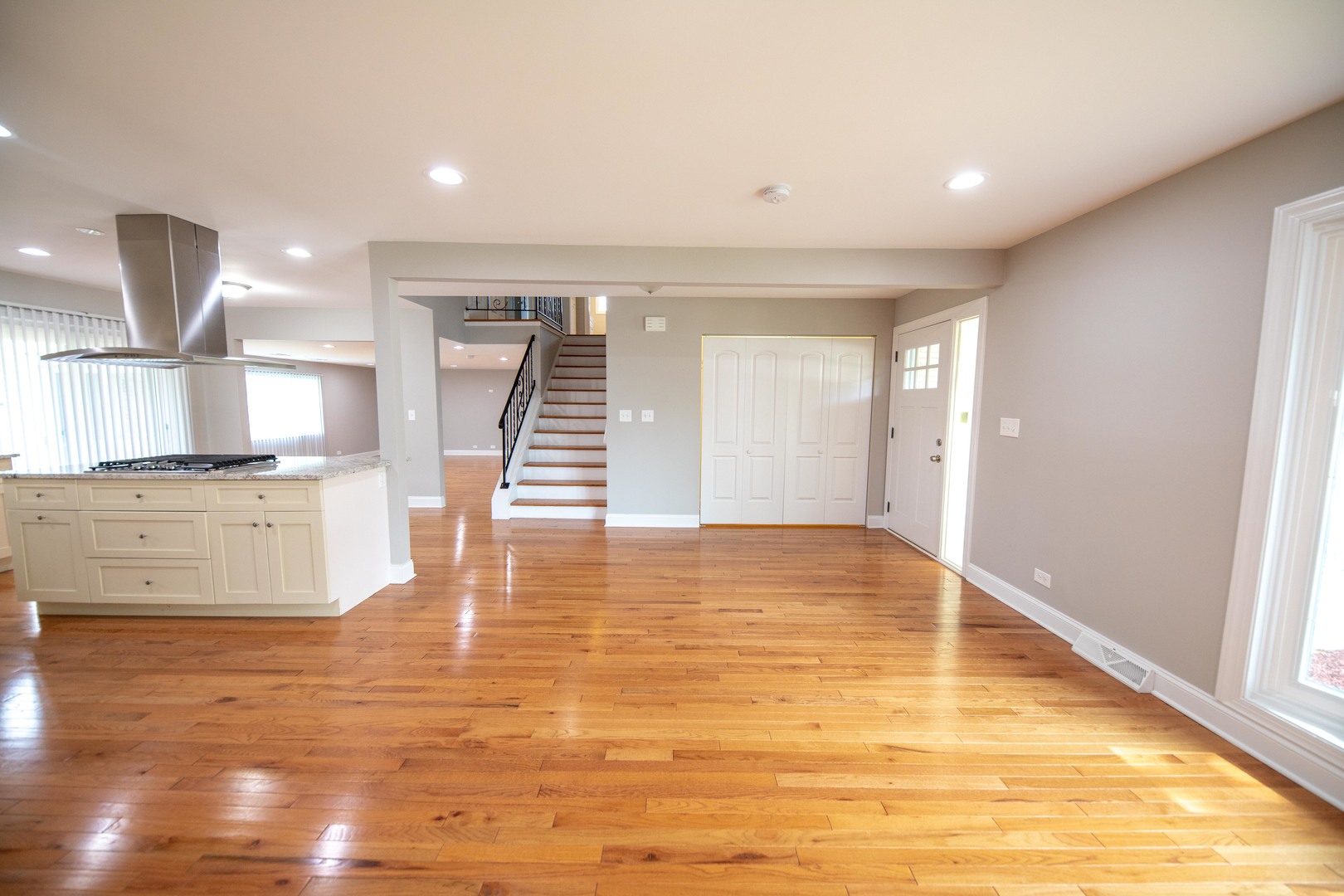 1722 East Aztec Lane Mount Prospect, IL 60056 - Photo 7 of 18 a view of a kitchen with wooden floor and a window