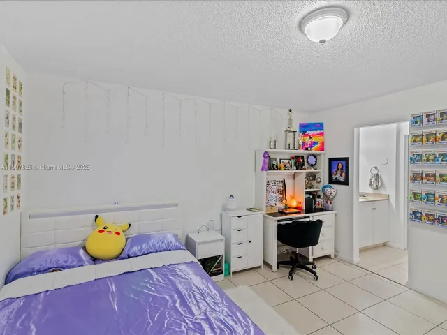 a bedroom with furniture and a book shelf