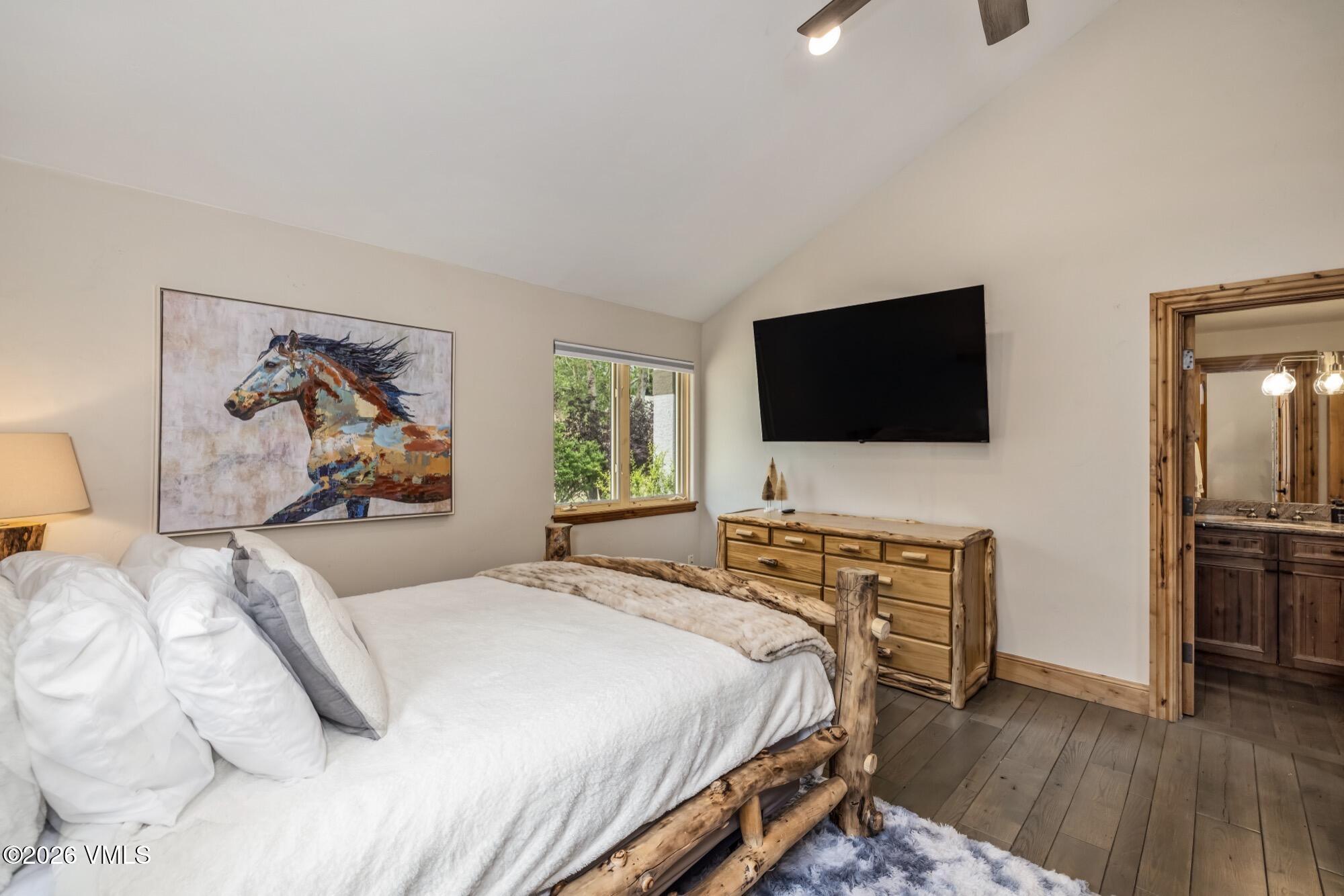 1671 Winslow Road Edwards, CO 81632 - Photo 29 of 48 a bedroom with a bed and a flat screen tv