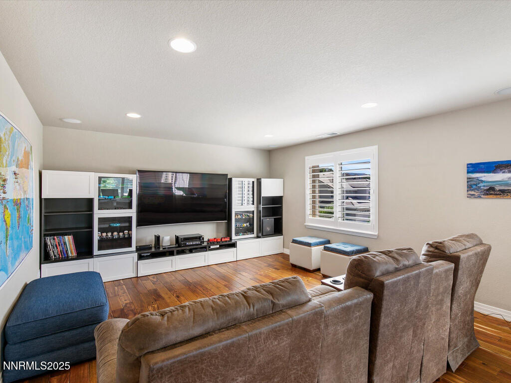 7284 Glenmore Court Reno, NV 89523 - Photo 11 of 28 a living room with furniture and a flat screen tv