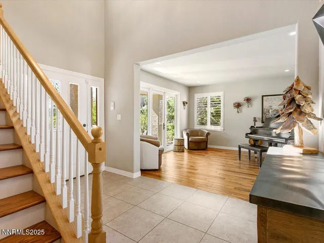a lobby with furniture and wooden floor