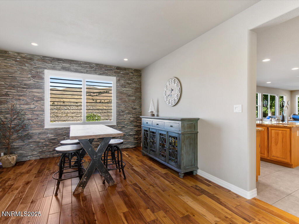 7284 Glenmore Court Reno, NV 89523 - Photo 17 of 28 a view of a dining room with furniture window and wooden floor