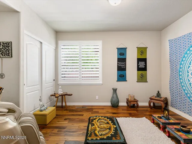 a bedroom with furniture and a window