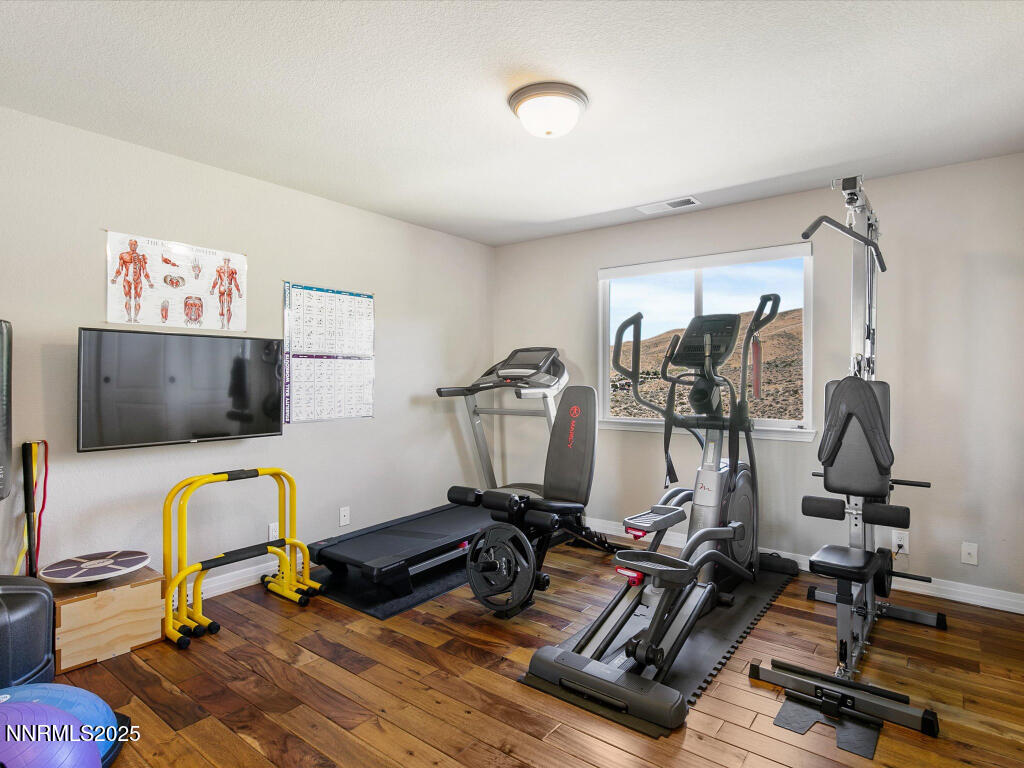 7284 Glenmore Court Reno, NV 89523 - Photo 19 of 28 a view of a room with gym equipment