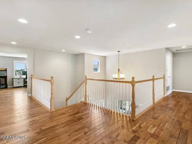 a view of a hallway with stairs