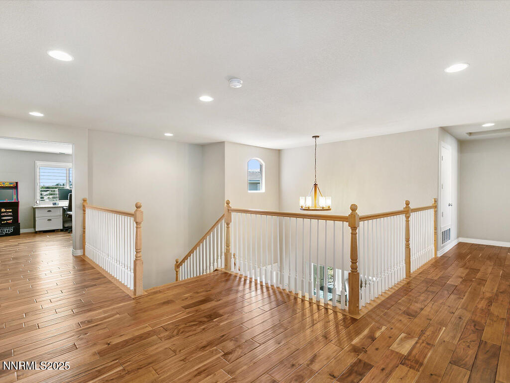 7284 Glenmore Court Reno, NV 89523 - Photo 23 of 28 a view of a hallway with stairs