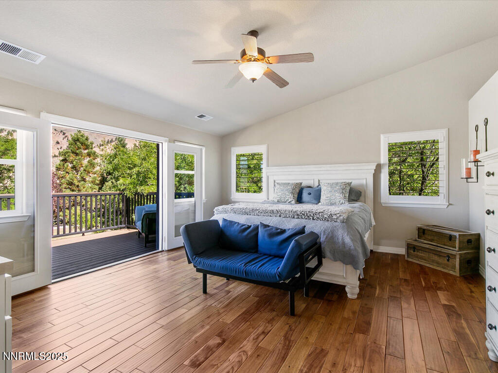 7284 Glenmore Court Reno, NV 89523 - Photo 8 of 28 a bedroom with a bed and a wooden floor