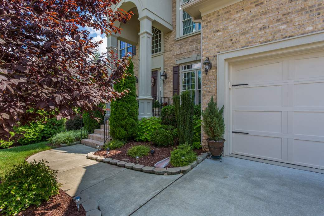 Exquisite landscaping all around the house, not just in front! Exterior Front
