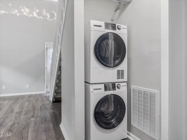 a view of a hallway with washer and dryer