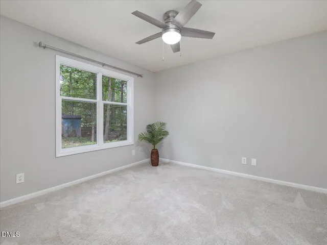 a view of a hallway with washer and dryer