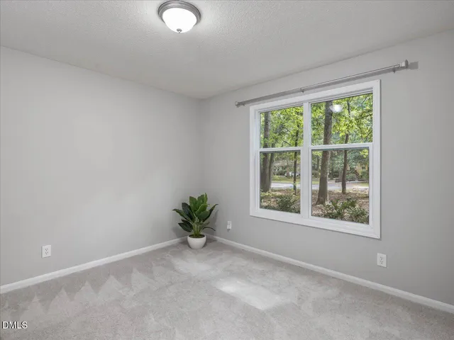 a bathroom with a sink a toilet a mirror and shower