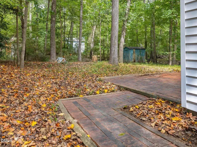 a view of an empty room with a ceiling fan