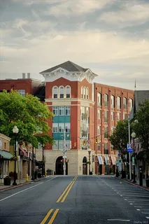 a view of a street with a building in the background