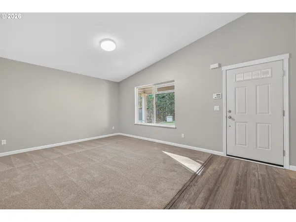 a view of an empty room with a window