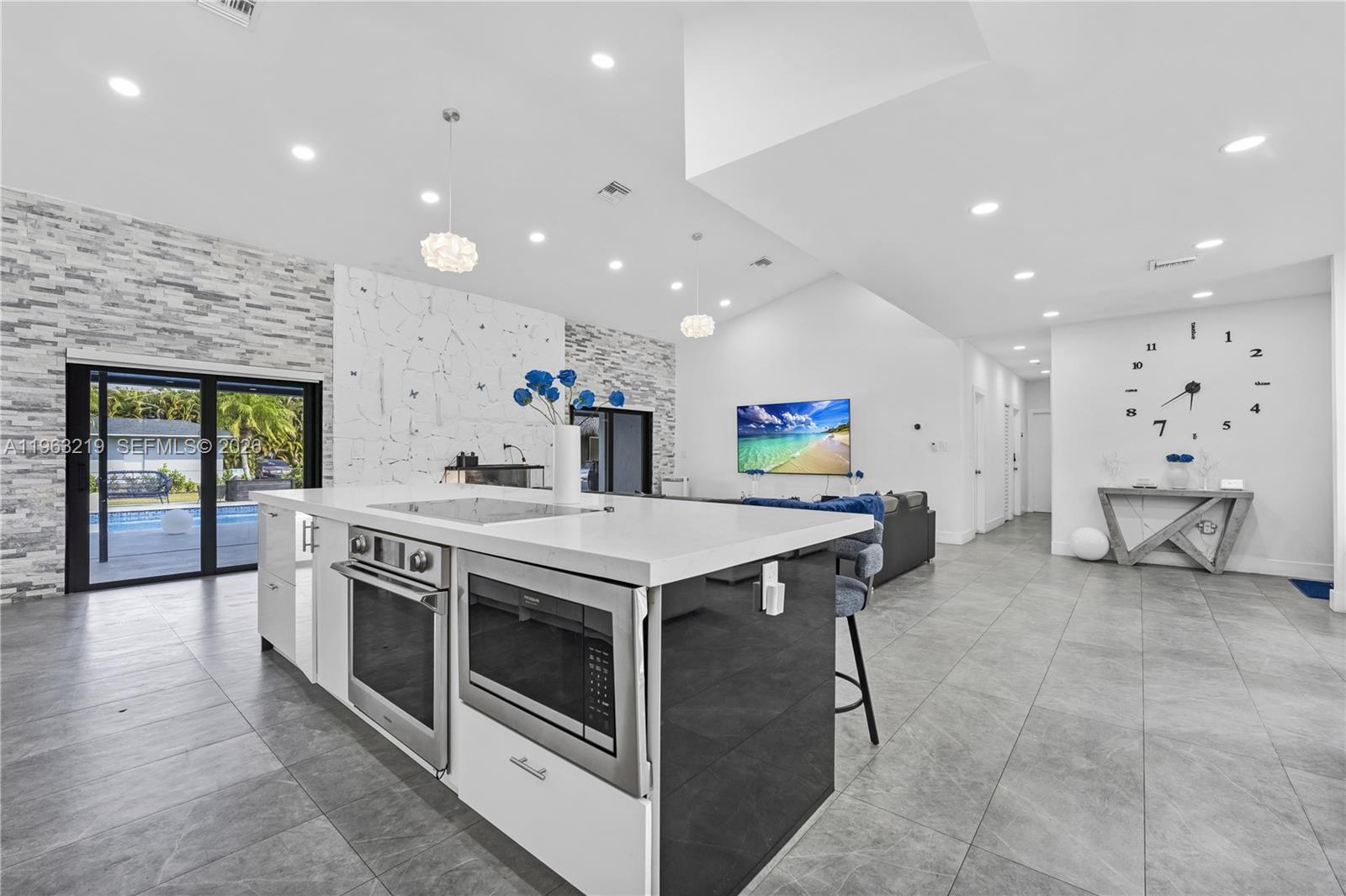 14651 Southwest 16th Street Davie, FL 33325 - Photo 15 of 52 a kitchen with stainless steel appliances granite countertop a stove and a sink