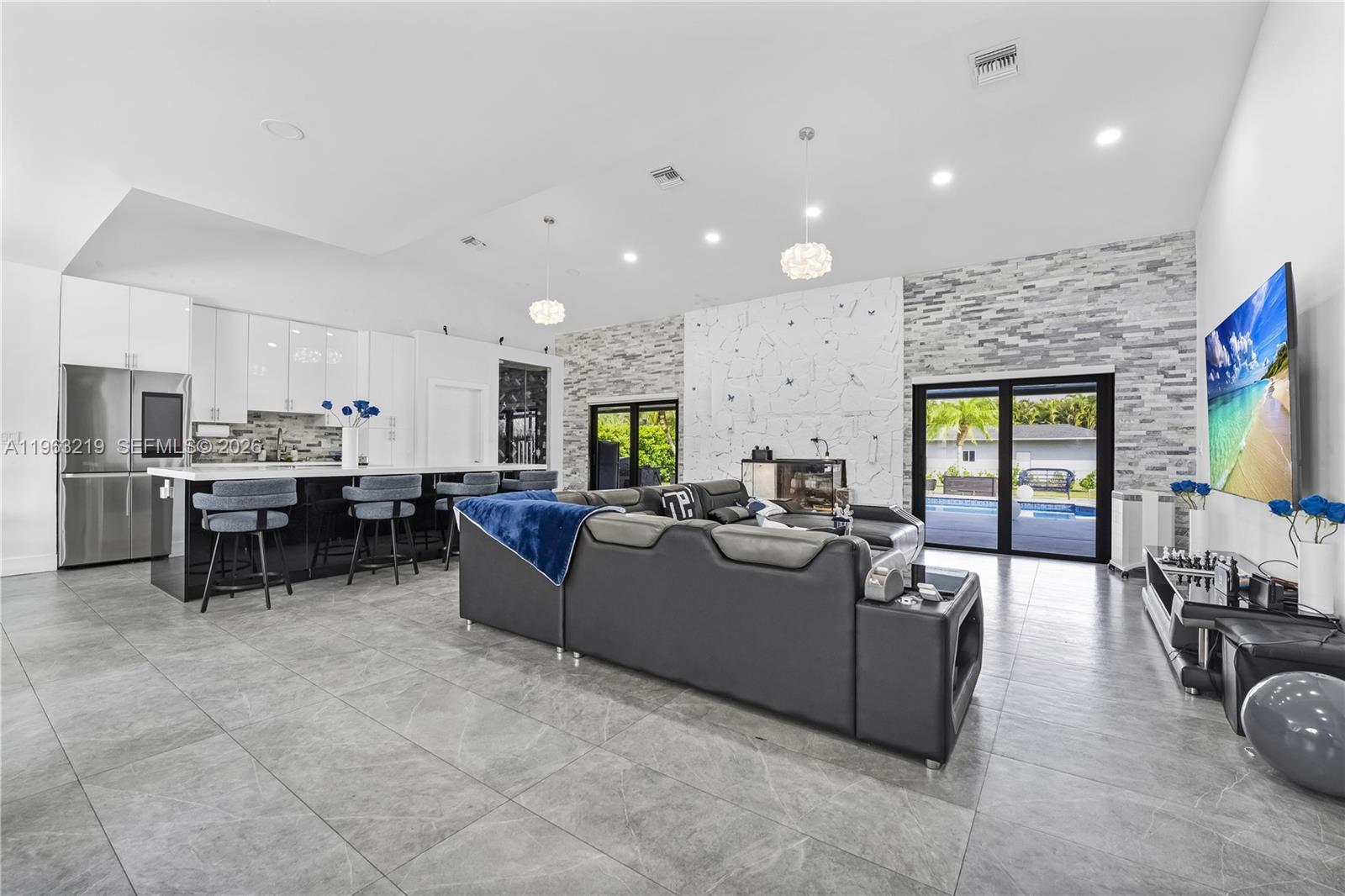 14651 Southwest 16th Street Davie, FL 33325 - Photo 20 of 52 a living room with furniture and kitchen view