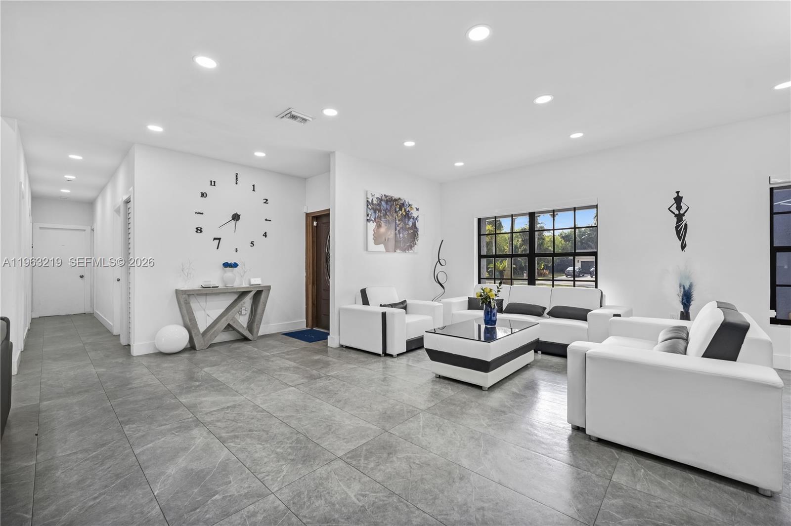 14651 Southwest 16th Street Davie, FL 33325 - Photo 21 of 52 a living room with furniture and a table