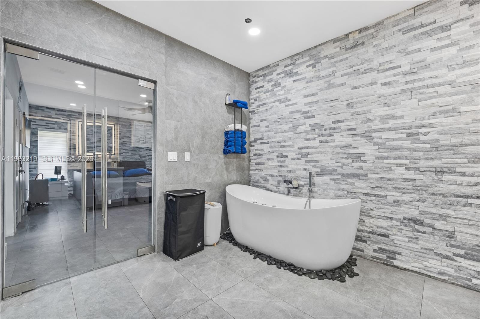 14651 Southwest 16th Street Davie, FL 33325 - Photo 28 of 52 a bathroom with a bathtub and shower