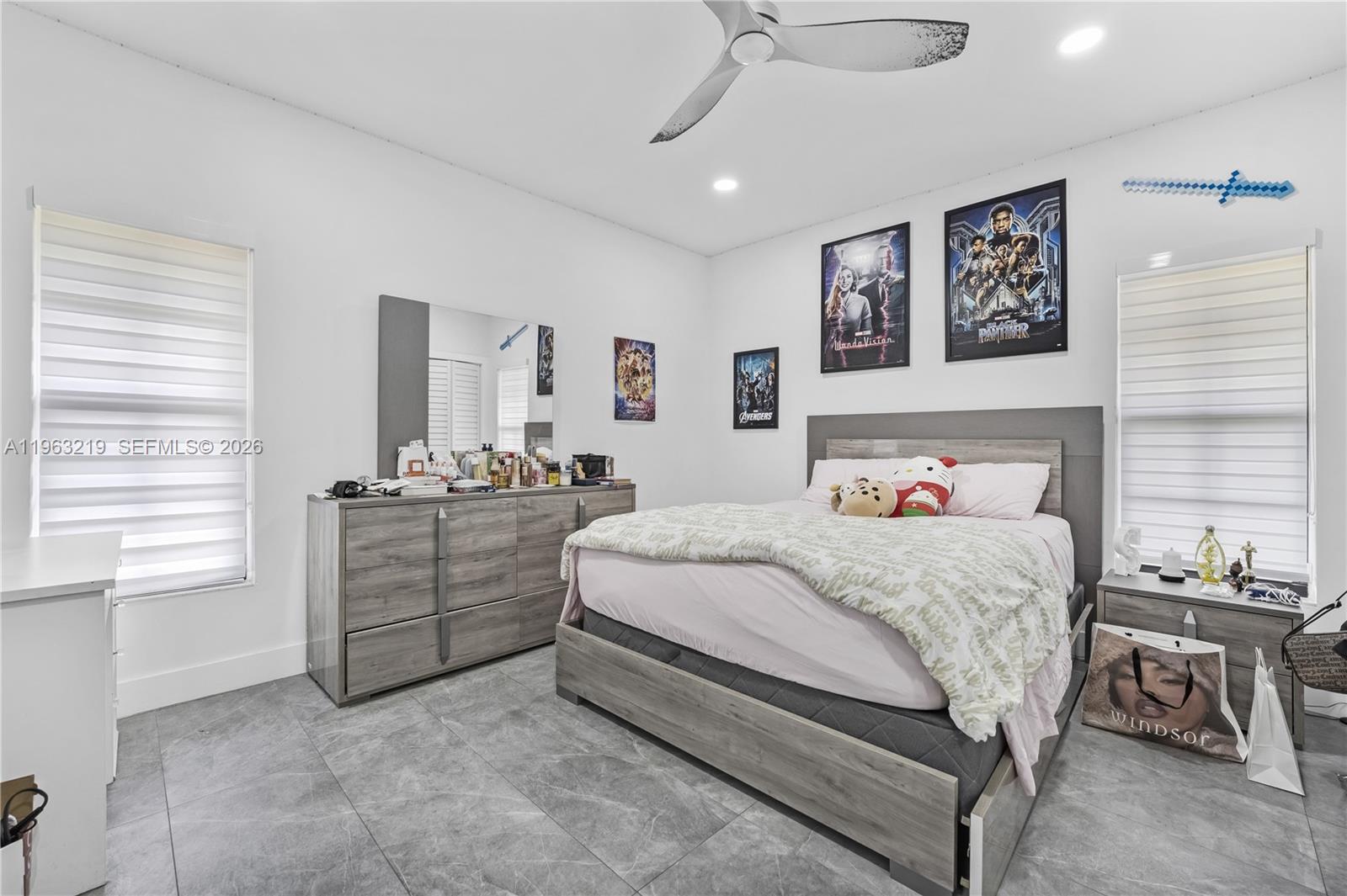 14651 Southwest 16th Street Davie, FL 33325 - Photo 30 of 52 a bedroom with a bed and a dresser