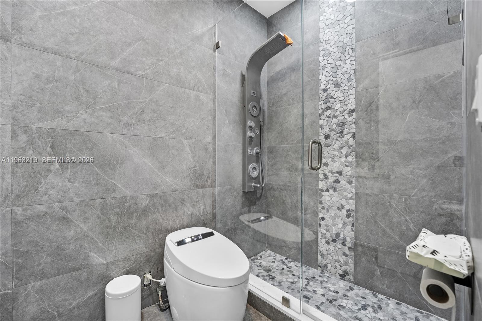 14651 Southwest 16th Street Davie, FL 33325 - Photo 31 of 52 a bathroom with a toilet and a shower