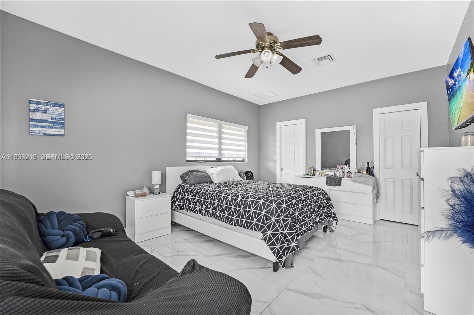 14651 Southwest 16th Street Davie, FL 33325 - Photo 40 of 52 a bedroom with a bed couches and window