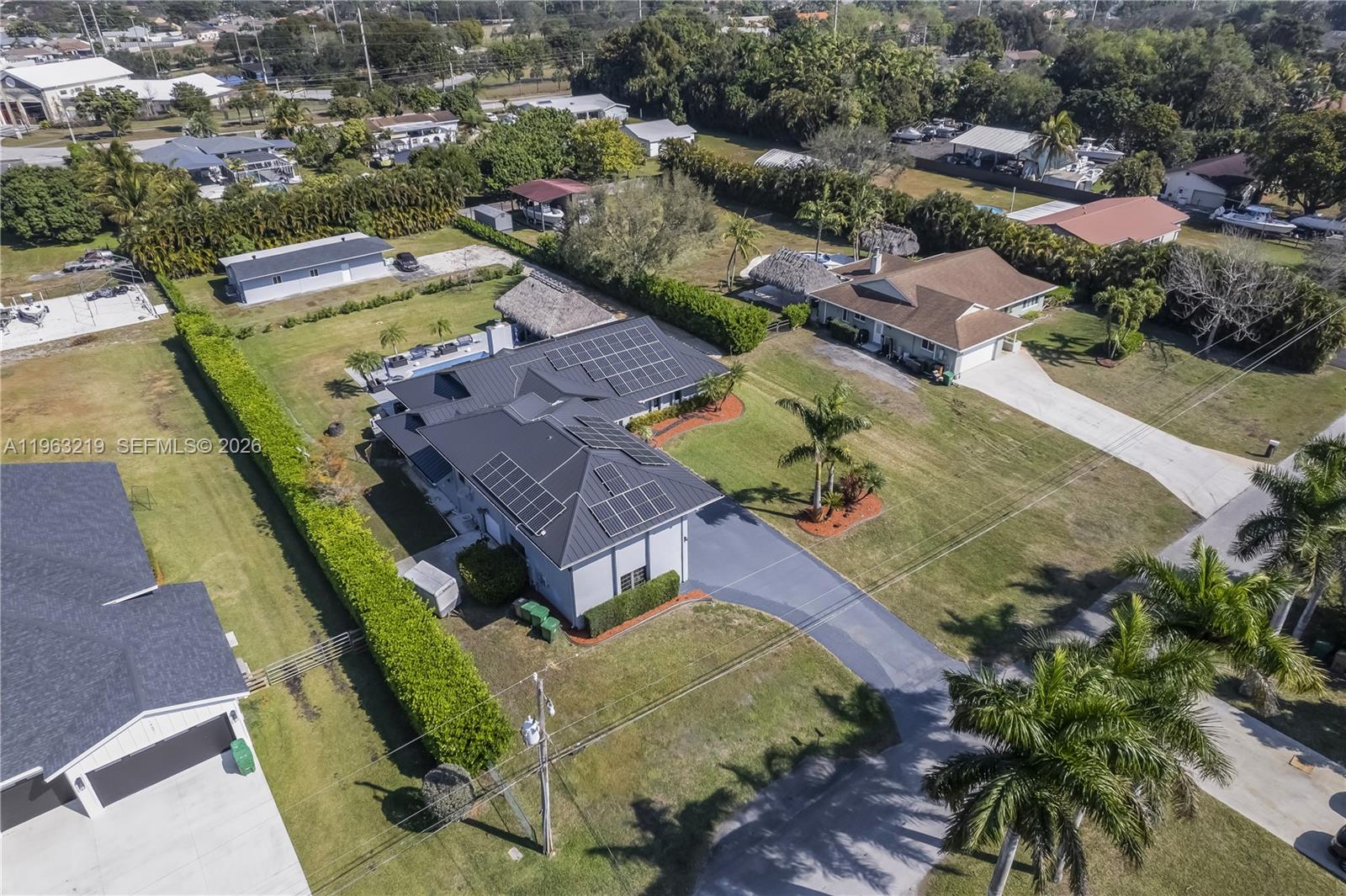 14651 Southwest 16th Street Davie, FL 33325 - Photo 4 of 52 an aerial view of a house with a garden