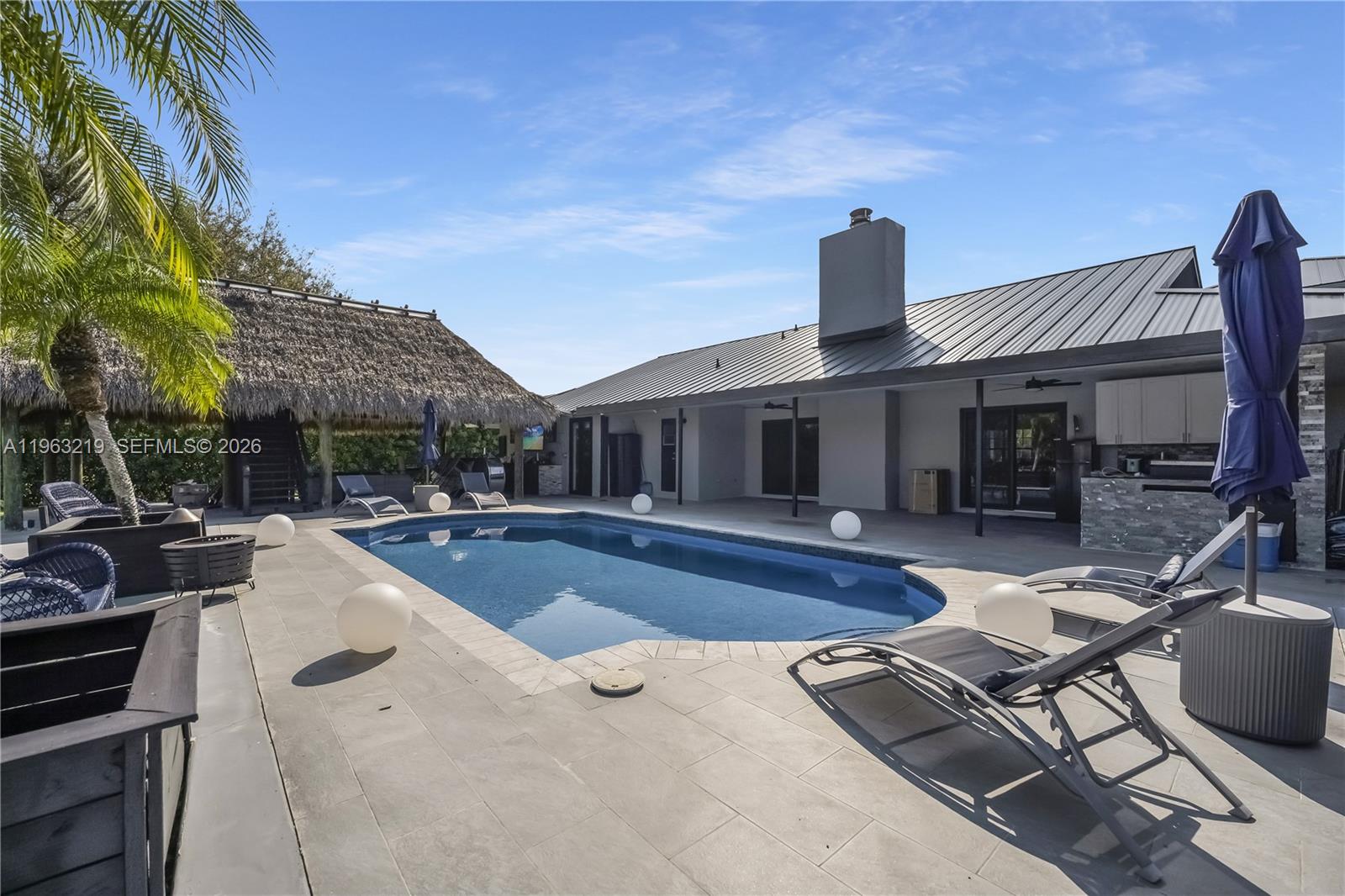 14651 Southwest 16th Street Davie, FL 33325 - Photo 43 of 52 a view of a house with swimming pool and sitting area