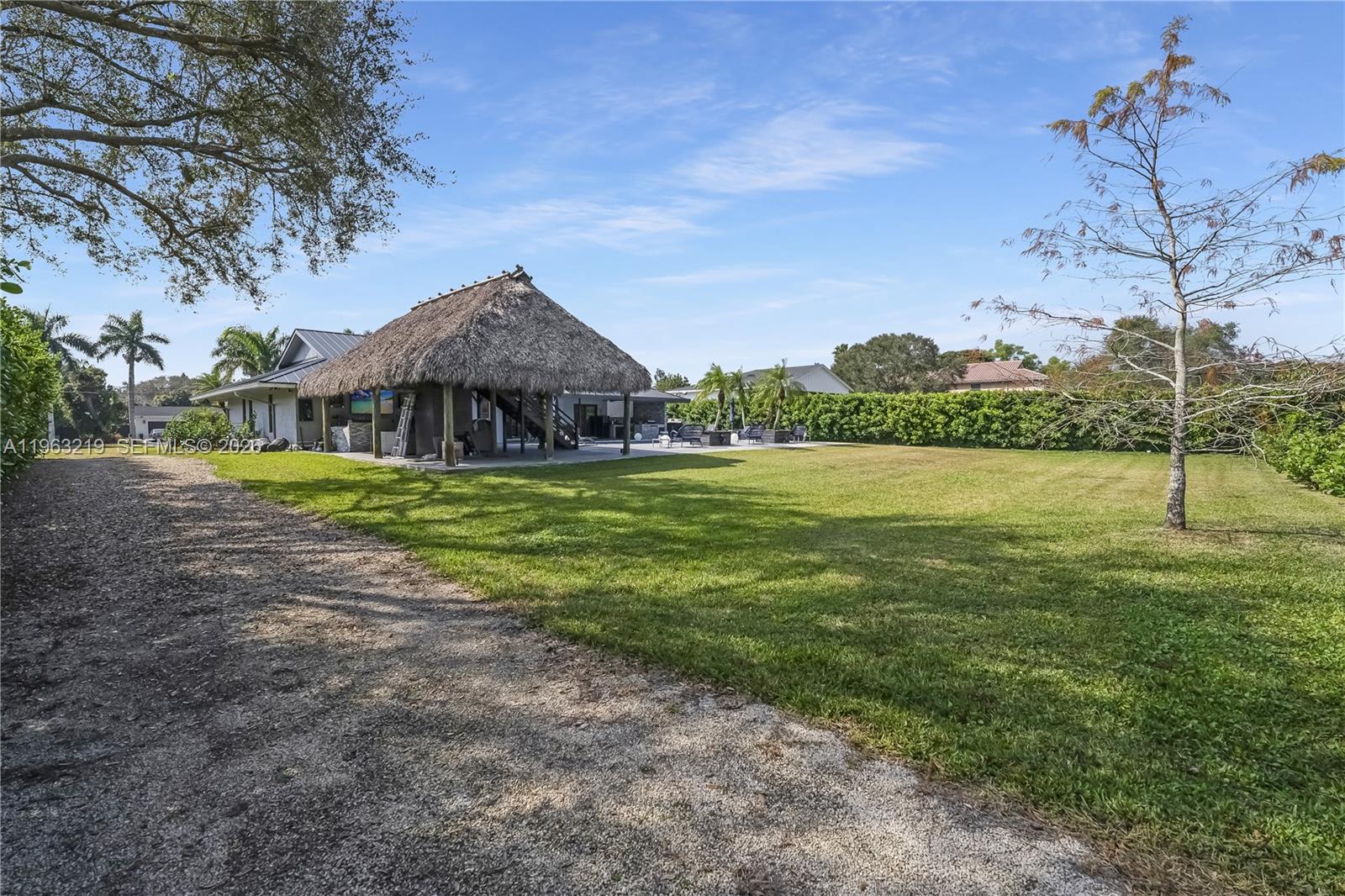 14651 Southwest 16th Street Davie, FL 33325 - Photo 50 of 52 a backyard of a house with lots of green space