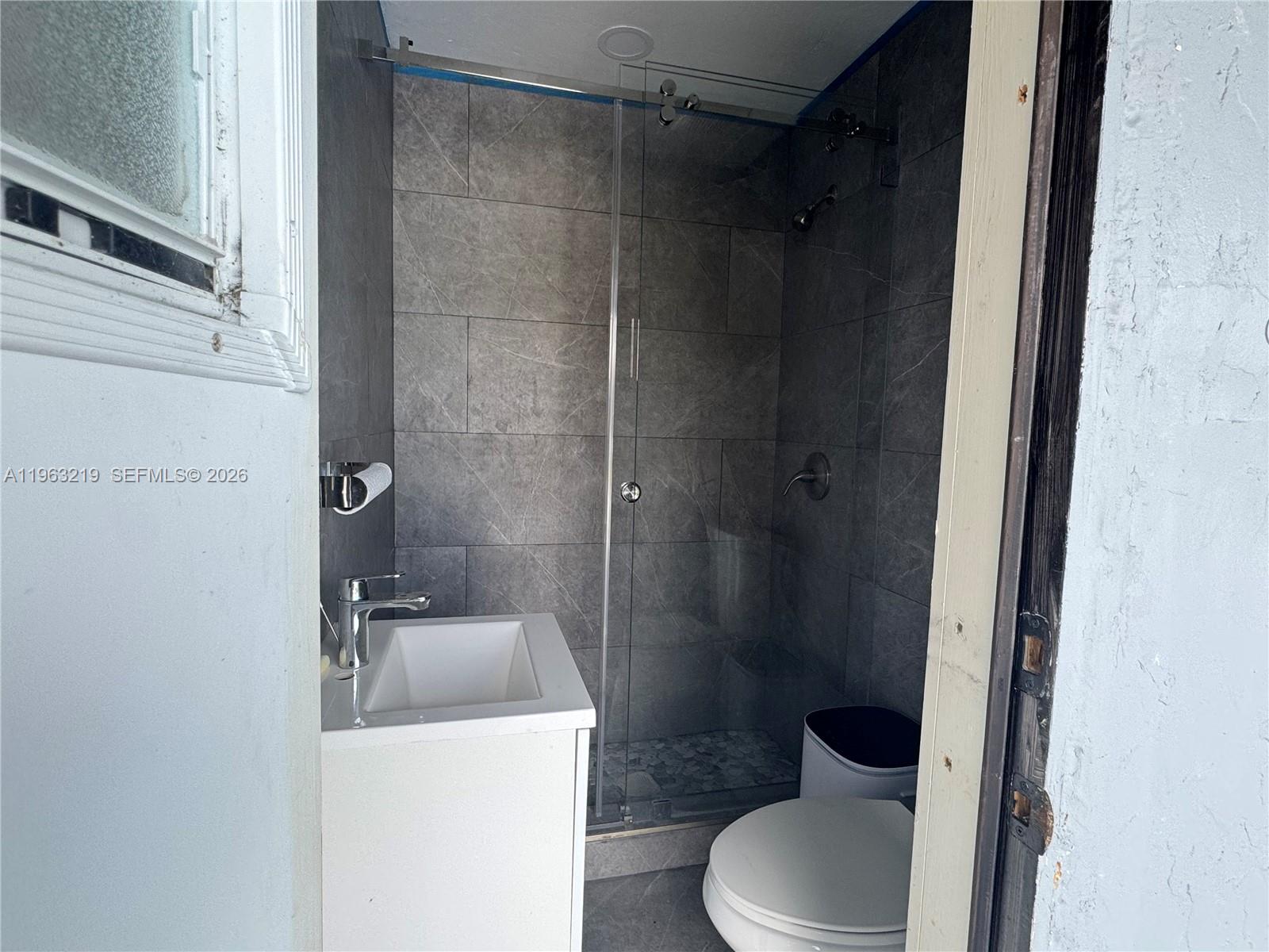 14651 Southwest 16th Street Davie, FL 33325 - Photo 52 of 52 a bathroom with a toilet and a sink