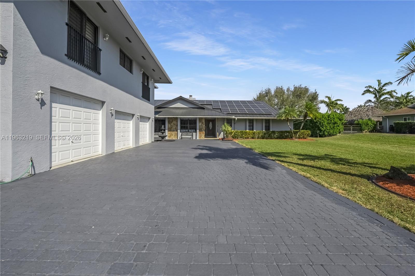 14651 Southwest 16th Street Davie, FL 33325 - Photo 8 of 52 front view of a house with a yard