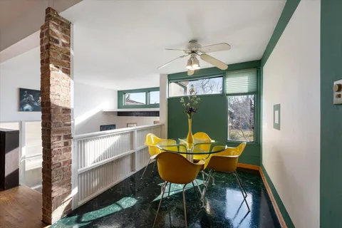 a dining room with furniture and window