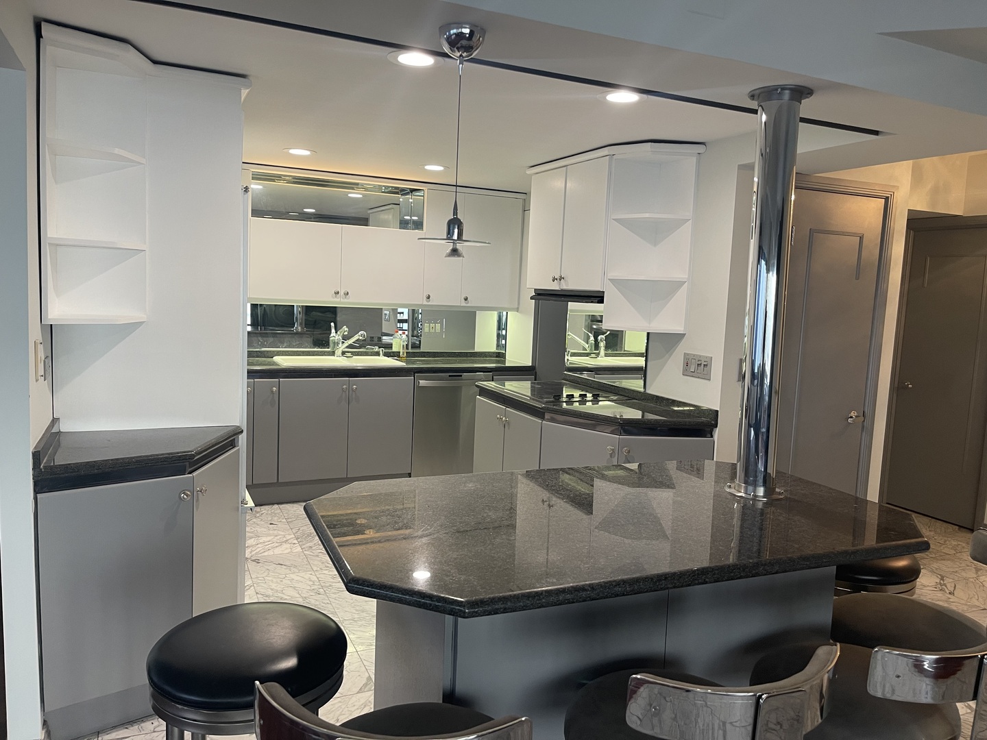 175 East Delaware Place, Unit 8604 Chicago, IL 60611 - Photo 12 of 31 a kitchen with a sink stainless steel appliances and cabinets