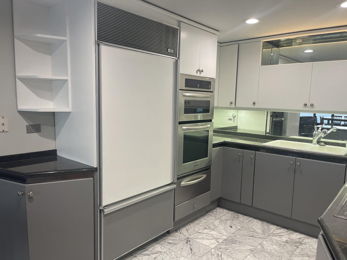175 East Delaware Place, Unit 8604 Chicago, IL 60611 - Photo 13 of 31 a kitchen with kitchen island granite countertop a sink stove and refrigerator