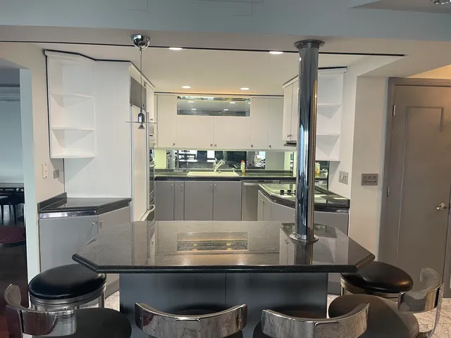 a kitchen with a stove and a refrigerator