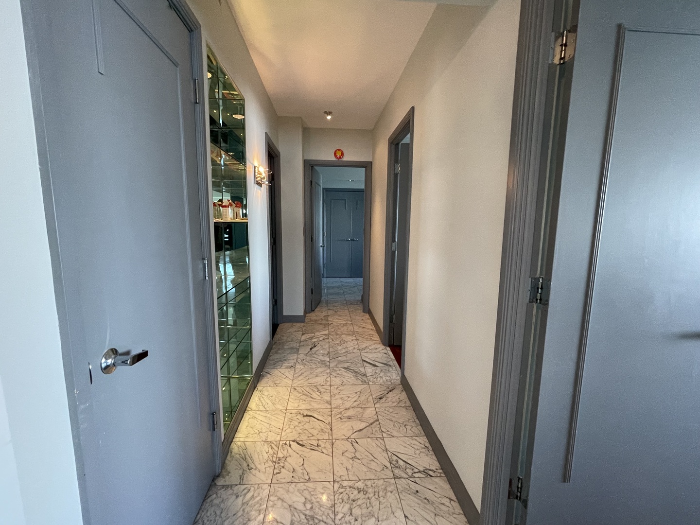 175 East Delaware Place, Unit 8604 Chicago, IL 60611 - Photo 17 of 31 a view of a hallway with wooden floor and a bathroom