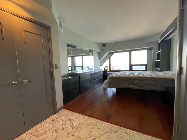 a bathroom with a shower and a toilet