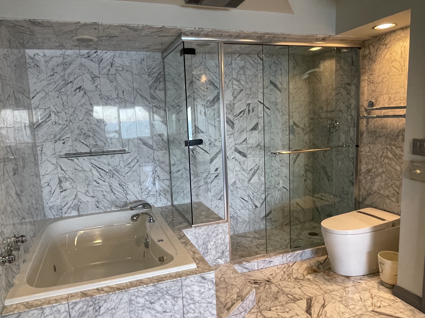 175 East Delaware Place, Unit 8604 Chicago, IL 60611 - Photo 21 of 31 a bathroom with a granite countertop bathtub shower and toilet