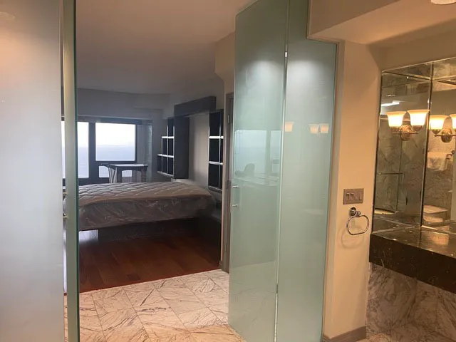 a bedroom with two beds and a dresser