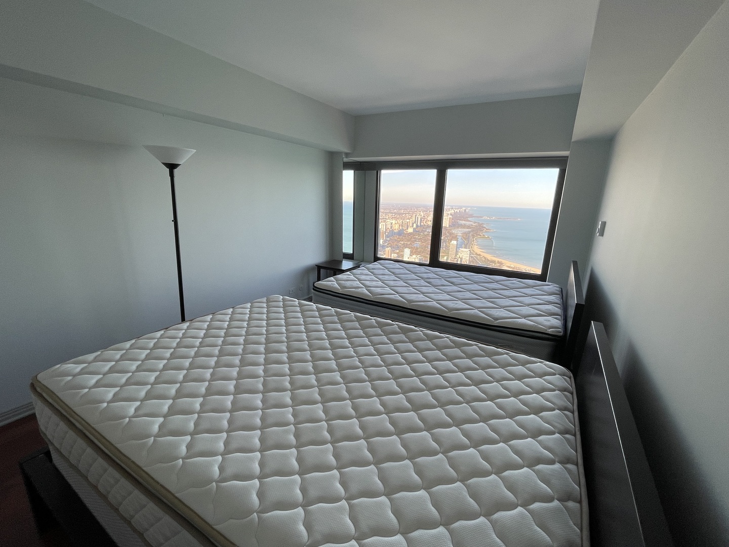 175 East Delaware Place, Unit 8604 Chicago, IL 60611 - Photo 25 of 31 a bedroom with a bed and window