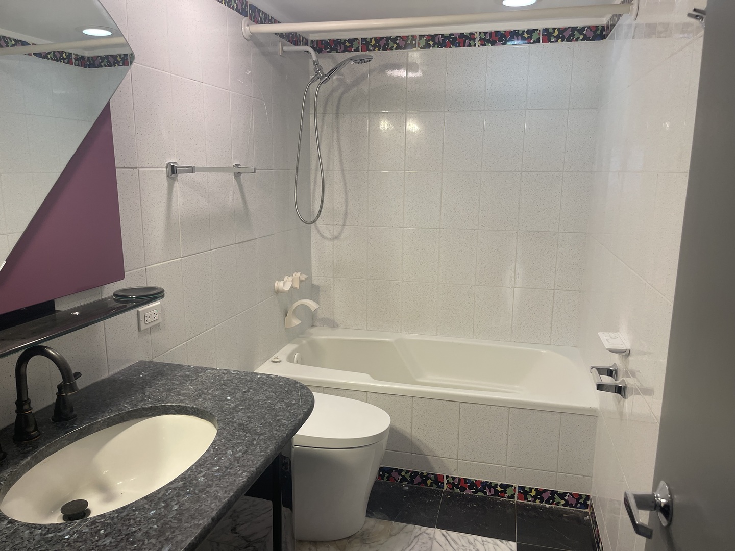 175 East Delaware Place, Unit 8604 Chicago, IL 60611 - Photo 26 of 31 a bathroom with a granite countertop sink toilet and shower