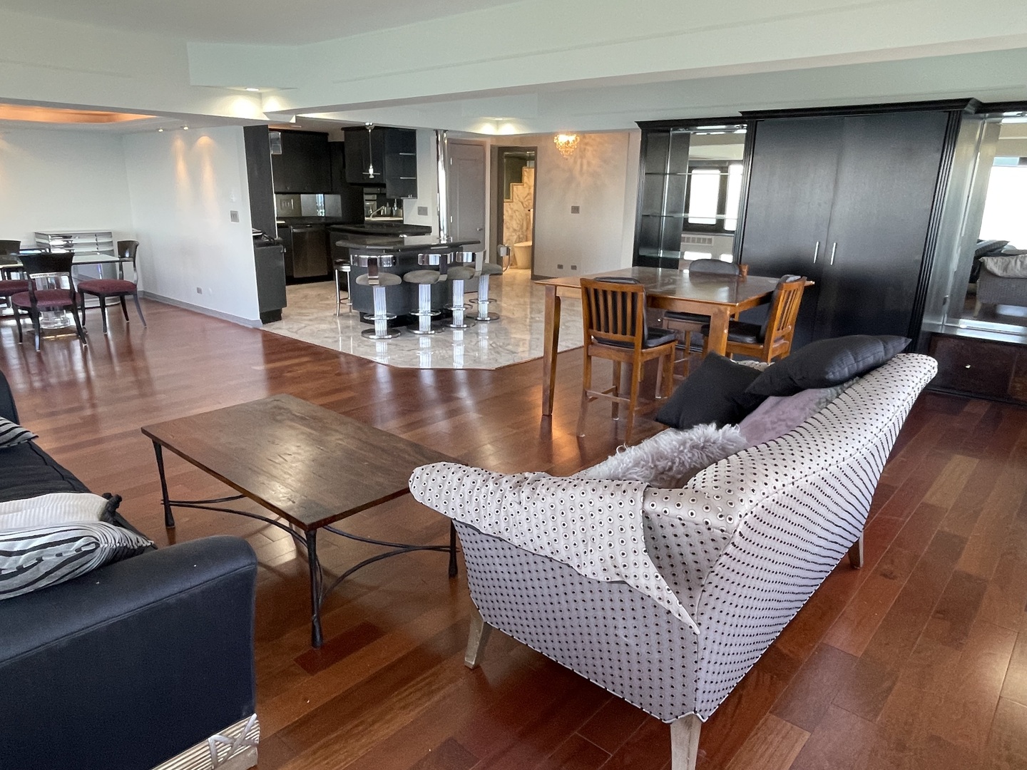 175 East Delaware Place, Unit 8604 Chicago, IL 60611 - Photo 5 of 31 a living room with furniture and wooden floor