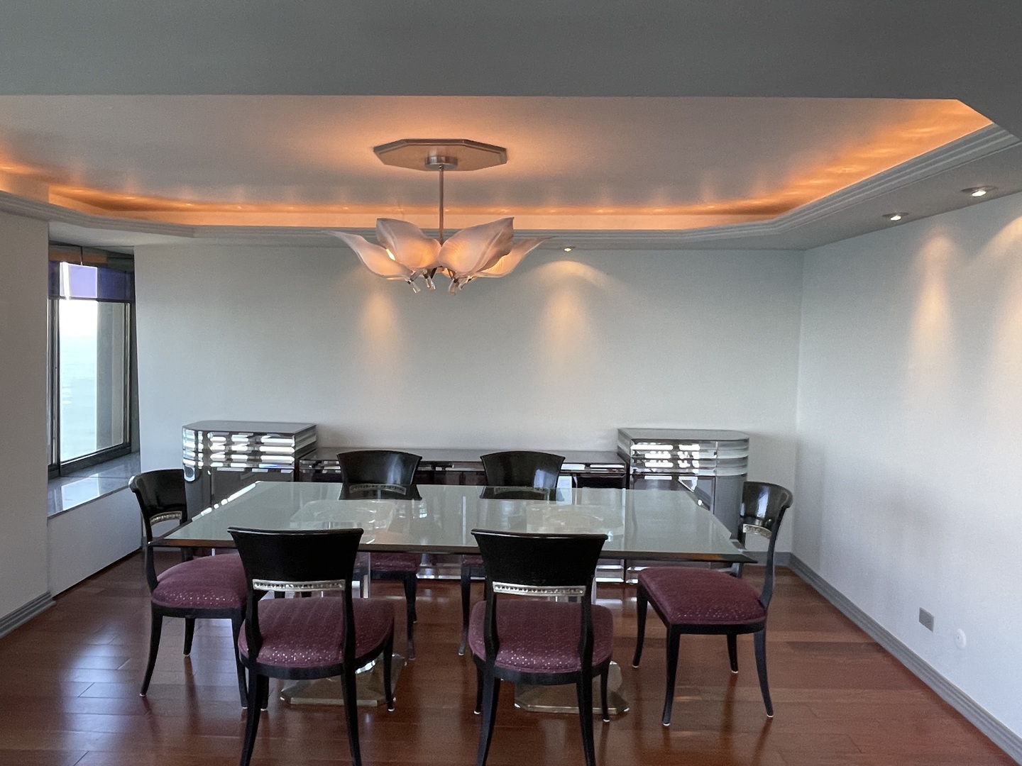 175 East Delaware Place, Unit 8604 Chicago, IL 60611 - Photo 10 of 31 a view of a dining room with furniture and wooden floor