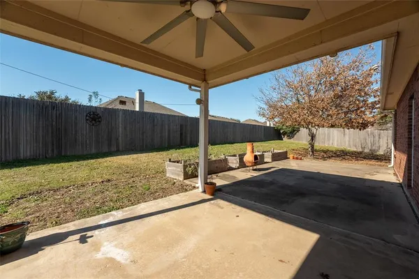 a view of a backyard of the house