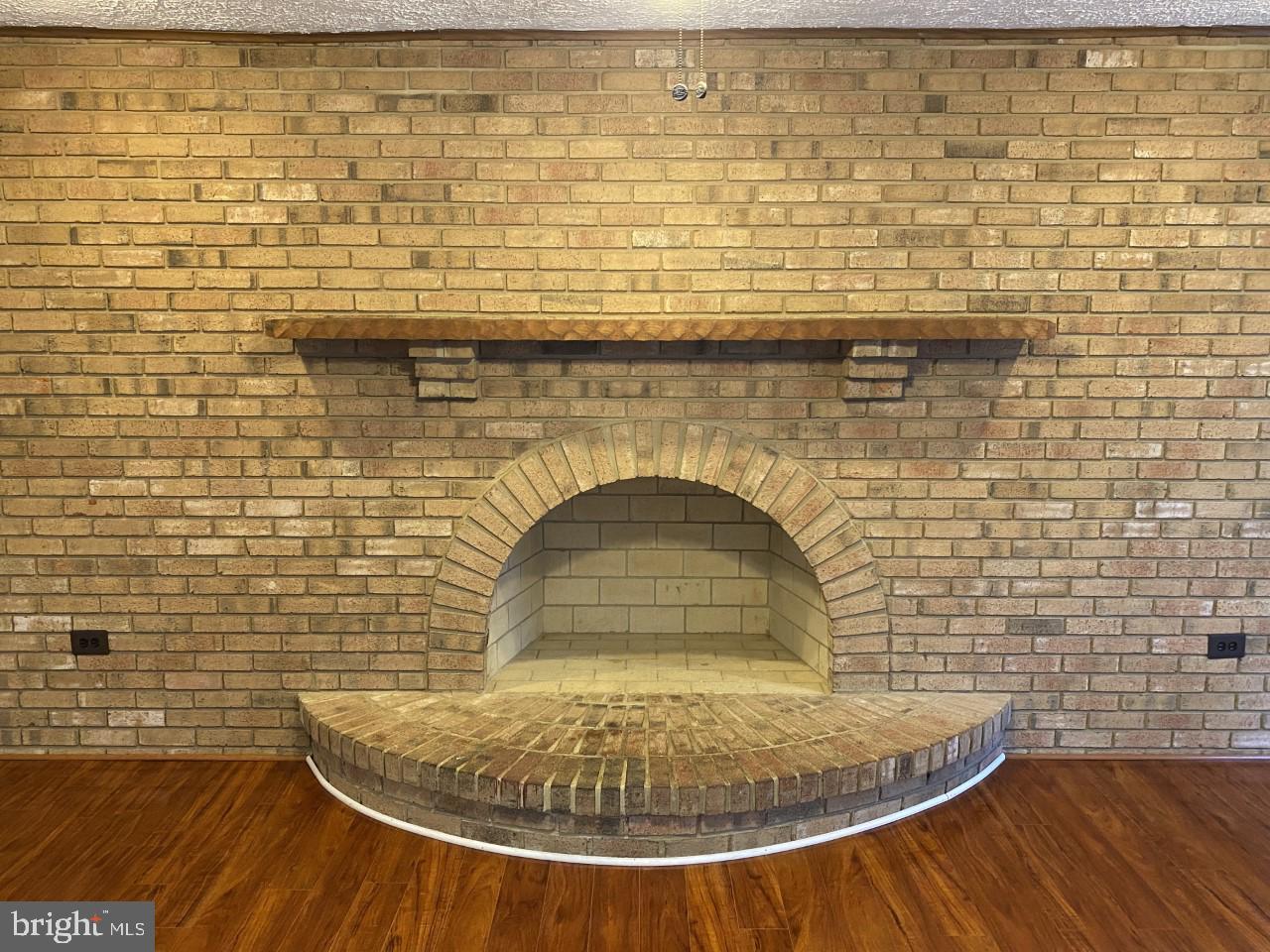 13600 Castle Cliff Way Silver Spring, MD 20904 - Photo 10 of 32 Warm Brick Fireplace